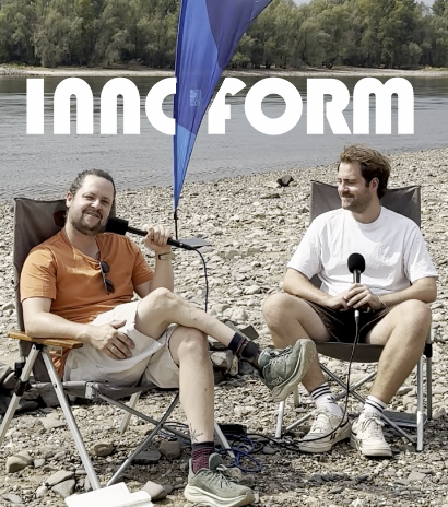 Two men podcasters sit in folding chairs on a rocky riverbank, holding microphones in an outdoor recording setup; a blue flag and a bold 'INNFORM' logo appear across the top.